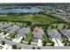 Beautiful aerial view of the home's location within the community, showcasing a nearby lake and well-maintained surroundings at 7406 Parkshore Dr, Apollo Beach, FL 33572
