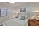 Serene bedroom with soft lighting, comfortable bed, and closet with ample storage space at 7406 Parkshore Dr, Apollo Beach, FL 33572