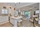 Inviting living room featuring an open concept layout, hardwood floors, and a view to the patio area at 7406 Parkshore Dr, Apollo Beach, FL 33572