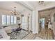 Bright living room with natural light, hardwood floors, and an open layout connecting to the dining and kitchen areas at 7406 Parkshore Dr, Apollo Beach, FL 33572