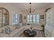 A sunlit living room with a comfortable sofa, stylish decor, and elegant lighting at 7406 Parkshore Dr, Apollo Beach, FL 33572