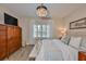 Inviting main bedroom with plantation shutters, soft textures, and a decorative sign at 7406 Parkshore Dr, Apollo Beach, FL 33572