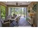 Inviting screened patio with brick flooring, ceiling fan, and outdoor furniture perfect for relaxing and entertaining at 7406 Parkshore Dr, Apollo Beach, FL 33572