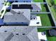 Aerial view of home with solar panels and neighborhood with fenced yards at 7554 Wallflower Trl, Wesley Chapel, FL 33545