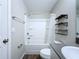 Bathroom featuring a shower-tub combo, a modern vanity, and sleek fixtures at 7554 Wallflower Trl, Wesley Chapel, FL 33545