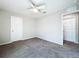 Cozy bedroom with neutral walls, carpet, and a ceiling fan for a tranquil space at 7554 Wallflower Trl, Wesley Chapel, FL 33545