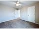 Bright bedroom with neutral walls, carpet, and a ceiling fan for comfortable living at 7554 Wallflower Trl, Wesley Chapel, FL 33545