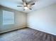 Bright bedroom featuring carpet and a window, perfect for a relaxing retreat at 7554 Wallflower Trl, Wesley Chapel, FL 33545