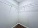 Walk in closet featuring wire shelving for simple organization at 7554 Wallflower Trl, Wesley Chapel, FL 33545
