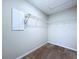 Compact walk-in closet featuring wire shelving and carpeted floor at 7554 Wallflower Trl, Wesley Chapel, FL 33545