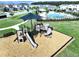 Playground aerial featuring various slides and climbing structures near community homes at 7554 Wallflower Trl, Wesley Chapel, FL 33545
