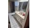 Cozy bathroom with a vanity, mirror, shower, and tub, providing a comfortable space at 8209 Chaucer Dr, Weeki Wachee, FL 34607