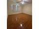 Bedroom with wood flooring and large window at 8209 Chaucer Dr, Weeki Wachee, FL 34607