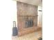 Stone fireplace with hearth at 8209 Chaucer Dr, Weeki Wachee, FL 34607