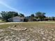 Charming single-story home with a two-car garage, solar panels, and a well-maintained lawn at 8209 Chaucer Dr, Weeki Wachee, FL 34607