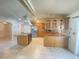 Spacious kitchen featuring light-colored wooden cabinetry and stainless steel appliances at 8209 Chaucer Dr, Weeki Wachee, FL 34607