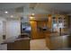 Spacious kitchen featuring custom wood cabinets, modern stainless steel appliances, and an island at 8209 Chaucer Dr, Weeki Wachee, FL 34607
