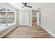 Bright bedroom with wood flooring, large closet and large window at 911 S Florida Ave, Tarpon Springs, FL 34689