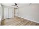 Bright bedroom with wood flooring, large closet and neutral paint at 911 S Florida Ave, Tarpon Springs, FL 34689