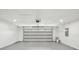 Clean two car garage with updated lighting and a new garage door at 911 S Florida Ave, Tarpon Springs, FL 34689