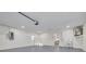 Spacious garage with utility sink, door to the backyard, and utility box at 911 S Florida Ave, Tarpon Springs, FL 34689