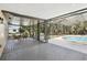 Spacious screened lanai features a pool and outdoor seating area at 911 S Florida Ave, Tarpon Springs, FL 34689