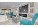 Comfortable living room area enhanced by recessed lighting, and features an electric fireplace for a cozy ambiance at 911 S Florida Ave, Tarpon Springs, FL 34689