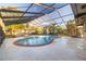 Screened-in pool with spacious patio area at 911 S Florida Ave, Tarpon Springs, FL 34689