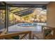 Screened-in pool with patio seating at 911 S Florida Ave, Tarpon Springs, FL 34689