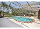 Enjoy this screened pool with spacious deck for relaxation and fun in the sun at 911 S Florida Ave, Tarpon Springs, FL 34689