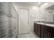 Bathroom featuring double sinks, granite countertop, and modern fixtures, with a shower and tub at 9640 Lemon Drop Loop, Ruskin, FL 33573