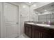 Bathroom featuring double sinks, granite countertop, and modern fixtures with neutral walls at 9640 Lemon Drop Loop, Ruskin, FL 33573