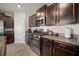 Kitchen features include stainless steel appliances, dark cabinets, and updated countertops at 9640 Lemon Drop Loop, Ruskin, FL 33573
