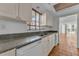 Bright kitchen with stainless steel sink, granite counters, and tile flooring at 1001 Pearce Dr # 106, Clearwater, FL 33764