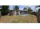 The backyard features a fenced yard, patio, and green space perfect for outdoor activities at 10118 114Th Ter, Largo, FL 33773