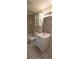 This bathroom features a single vanity, tiled floors, and a shower-tub combination at 10118 114Th Ter, Largo, FL 33773