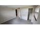 Cozy bedroom featuring plush carpeting, a spacious closet, and natural light at 10118 114Th Ter, Largo, FL 33773