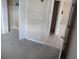 Bright bedroom with neutral carpet, a closet, and access to the hall at 10118 114Th Ter, Largo, FL 33773
