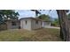 The home's exterior includes well-kept landscaping and a view of the side yard and patio at 10118 114Th Ter, Largo, FL 33773