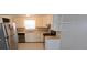 A functional kitchen features stainless appliances and a neutral color palette at 10118 114Th Ter, Largo, FL 33773