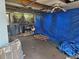 Enclosed back porch needing renovation; exposed ceiling and concrete floor offers customization at 10264 117Th Ter, Largo, FL 33773