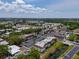Drone shot of the apartment complex, highlighting the community's layout and amenities like a pool at 1100 East Bay Dr # 42, Largo, FL 33770