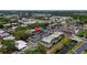 Aerial view showcases the apartment complex layout, parking, and surrounding lush green landscape at 1100 East Bay Dr # 42, Largo, FL 33770
