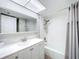 Bathroom features a vanity sink, mirrored medicine cabinet, and shower with tile surround at 1100 East Bay Dr # 42, Largo, FL 33770