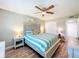 Relaxing bedroom features stylish furniture, ceiling fan, and coastal-inspired decor at 1100 East Bay Dr # 42, Largo, FL 33770