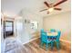 Cozy dining area featuring a ceiling fan and a pass-through to the kitchen for easy serving at 1100 East Bay Dr # 42, Largo, FL 33770