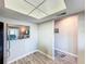 Dining area with an opening to the living room, showcasing hardwood floors and light, neutral walls at 1100 East Bay Dr # 42, Largo, FL 33770