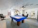 Game room with a pool table, ceiling fan, and comfortable seating, perfect for leisure and entertainment at 1100 East Bay Dr # 42, Largo, FL 33770