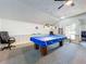 Game room with a pool table, ceiling fan, and comfortable seating, perfect for leisure and entertainment at 1100 East Bay Dr # 42, Largo, FL 33770