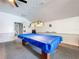 Game room with a pool table, ceiling fan, and comfortable seating, perfect for leisure and entertainment at 1100 East Bay Dr # 42, Largo, FL 33770
